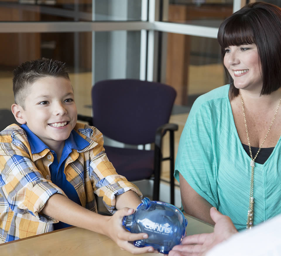 Photo of a child with a piggy bank