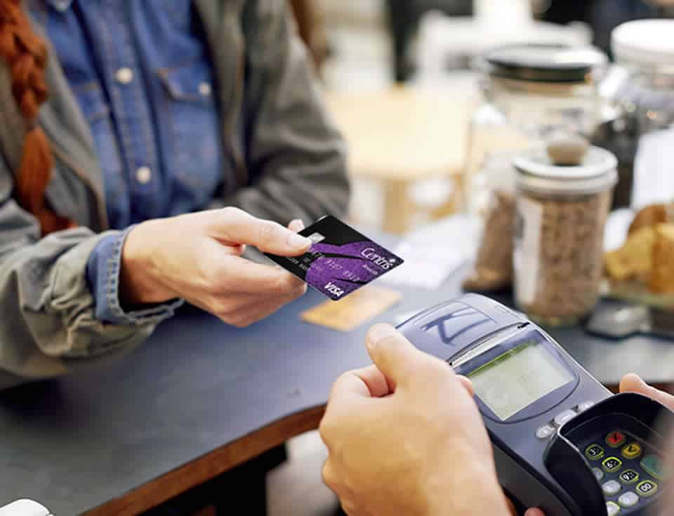 Photo of a customer making a purchase with their Centris credit card