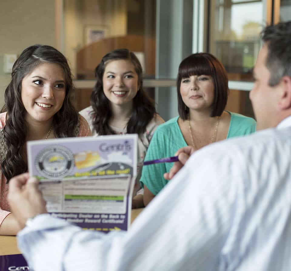Photo of a family learning about Centris savings accounts