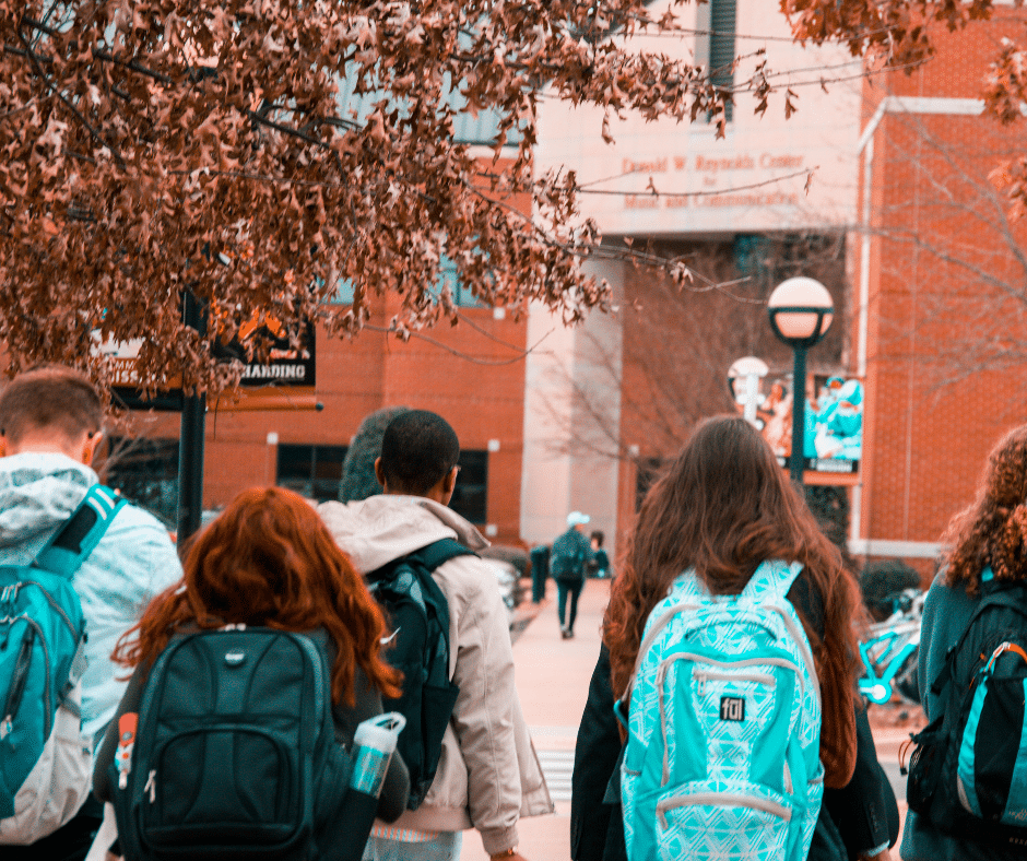 College students wearing backpacks on campus
