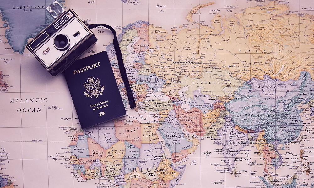 World map, passport and camera